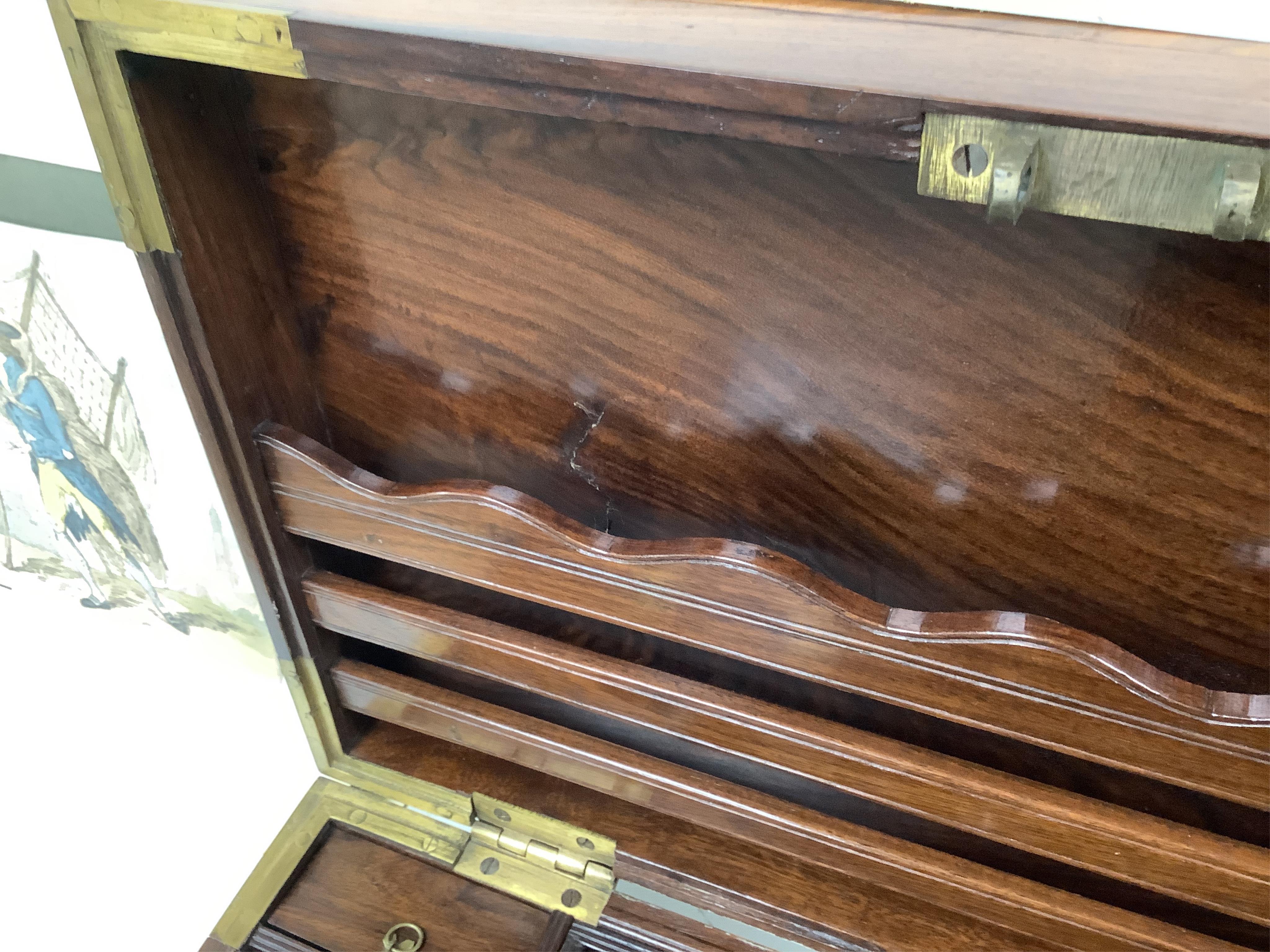 A 1920’s Anglo Indian brass mounted rosewood chest with fitted interior and key, 48cm wide. Condition - fair/good